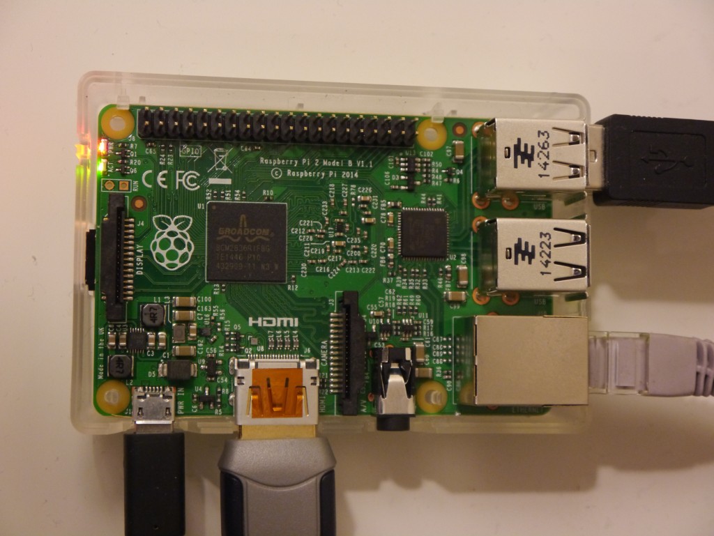 The Pi with USB power, HDMI, Ethernet and two slave USB devices connected.